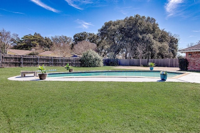 view of pool with a fenced backyard, a fenced in pool, and a yard