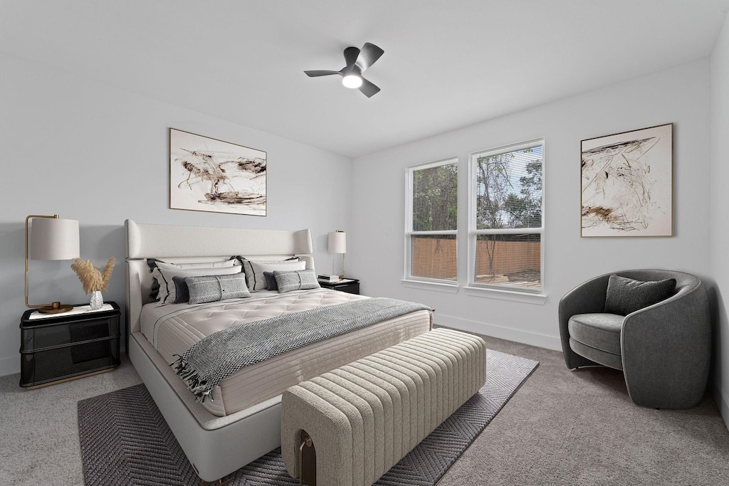 bedroom with carpet, ceiling fan, and baseboards