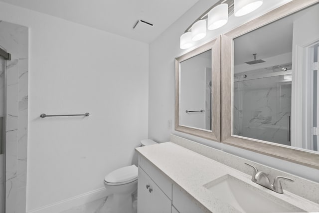 full bathroom featuring toilet, vanity, baseboards, marble finish floor, and a marble finish shower