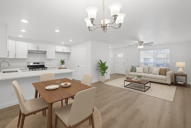 819 Netherland Dr, Arlington, TX 76017 - dining room with recessed lighting, baseboards, light wood finished floors, a chandelier, and a ceiling fan