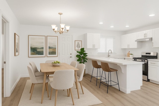 819 Netherland Dr, Arlington, TX 76017 - dining room featuring light wood-type flooring, a chandelier, recessed lighting, and baseboards
