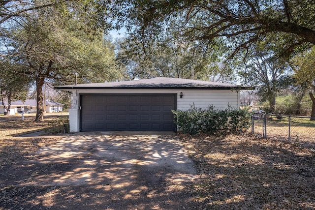 garage featuring fence