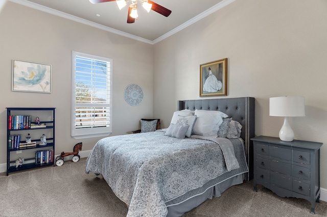 carpeted bedroom featuring ceiling fan, baseboards, and crown molding