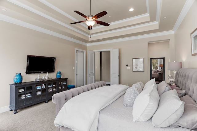 bedroom featuring recessed lighting, light colored carpet, baseboards, a tray ceiling, and crown molding