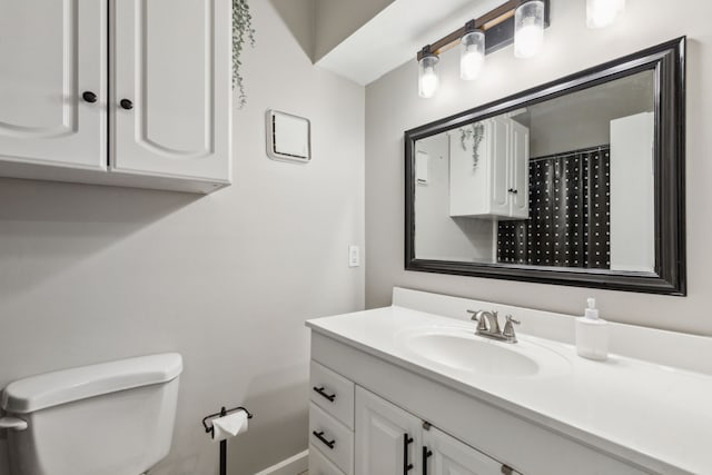 full bathroom featuring vanity and toilet