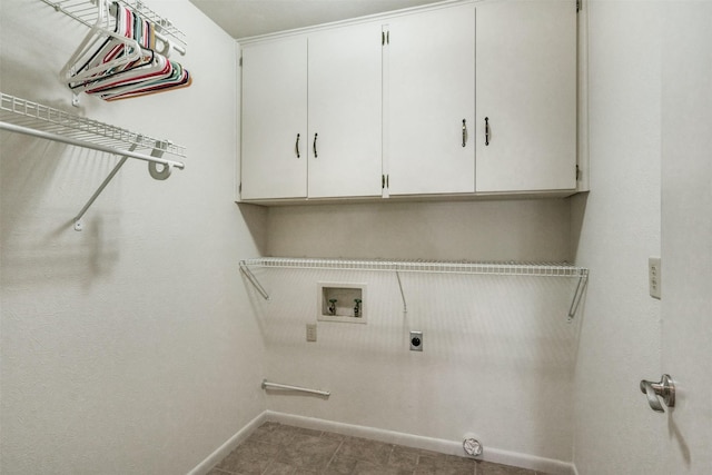 laundry area featuring baseboards, washer hookup, cabinet space, and hookup for an electric dryer