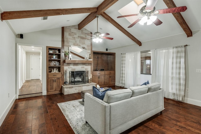 living area with lofted ceiling with beams, a stone fireplace, dark wood-type flooring, visible vents, and baseboards