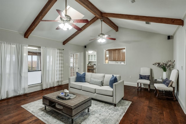 living area with vaulted ceiling with beams, wood finished floors, and baseboards