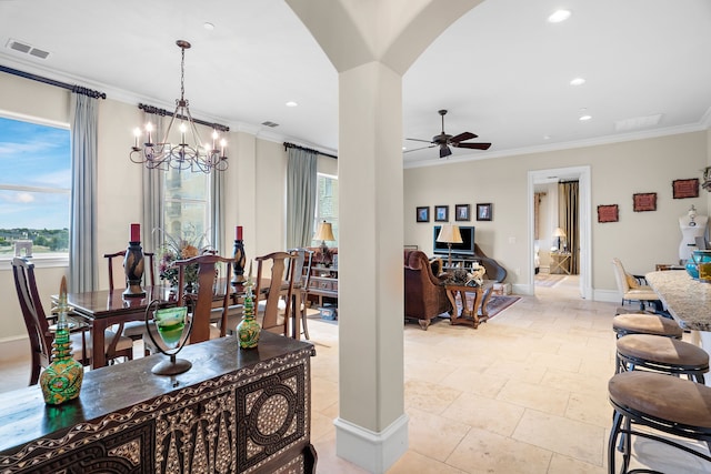 dining room with ornamental molding, arched walkways, visible vents, and plenty of natural light