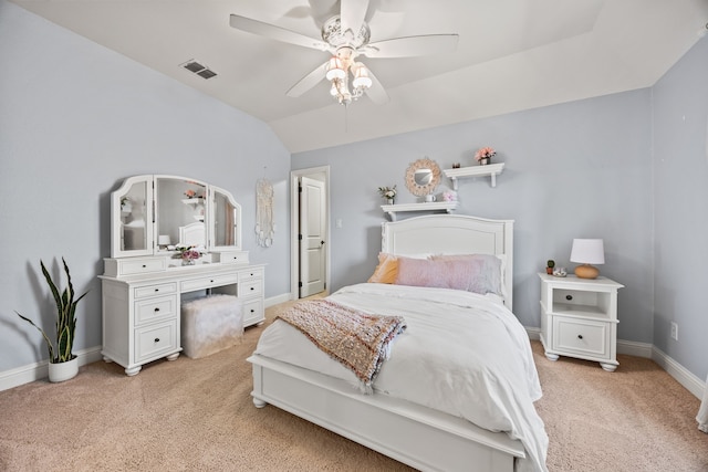 bedroom featuring baseboards, visible vents, light carpet, and lofted ceiling