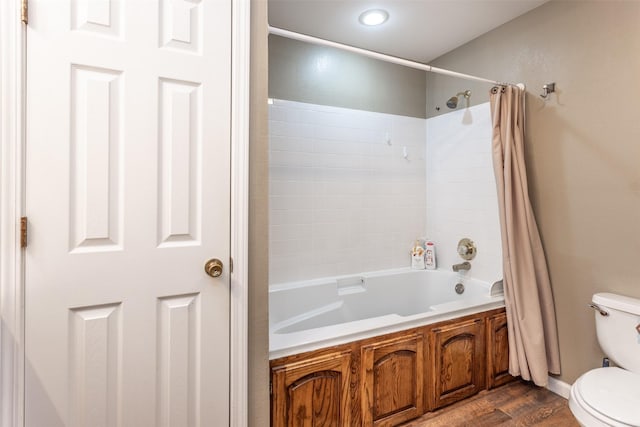 2317 Jodi Ln, Gainesville, TX 76240 - full bathroom with toilet, shower / bath combo, and wood finished floors