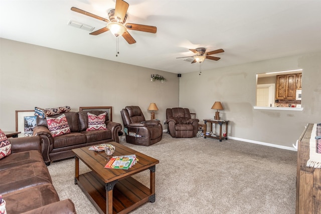 2317 Jodi Ln, Gainesville, TX 76240 - living area featuring ceiling fan, carpet floors, and baseboards