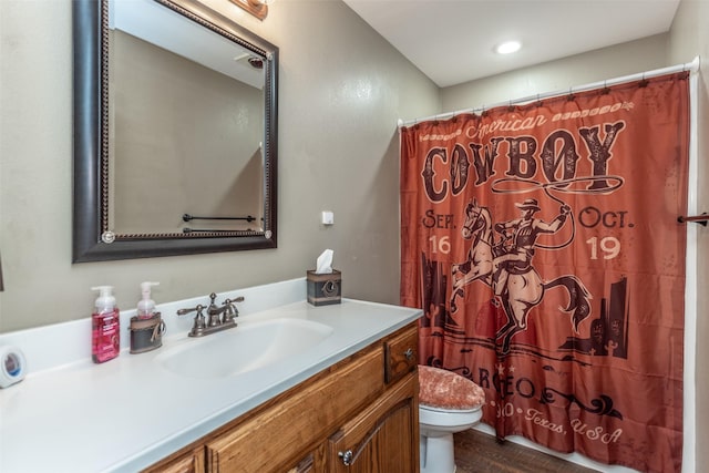 2317 Jodi Ln, Gainesville, TX 76240 - bathroom with toilet, vanity, curtained shower, and wood finished floors