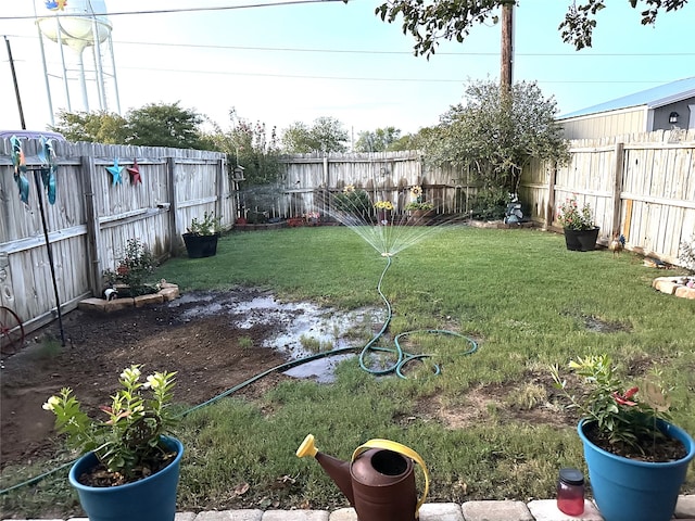 view of yard with a fenced backyard