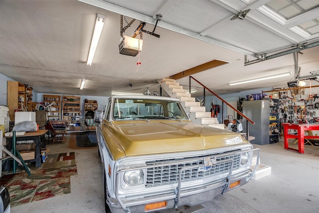 garage featuring a workshop area and a garage door opener