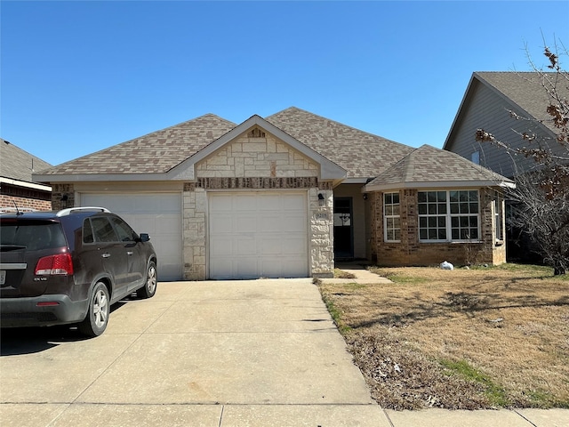 view of front of house featuring a garage, stone siding, concrete driveway, and roof with shingles