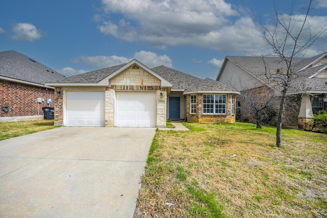 view of front of home with driveway, a front lawn, stone siding, an attached garage, and a shingled roof