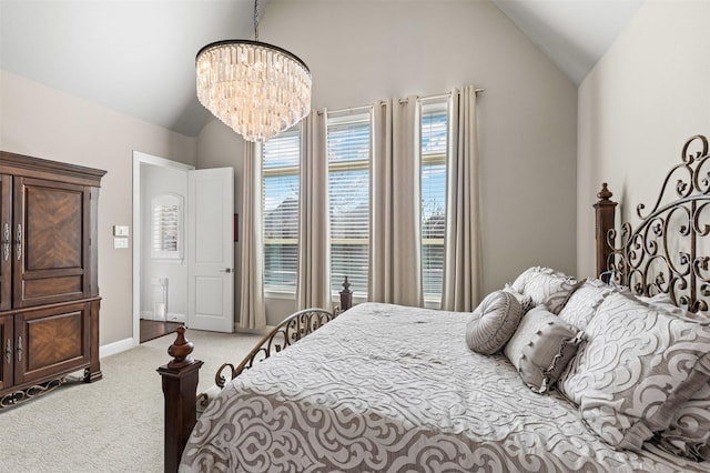 carpeted bedroom with lofted ceiling, an inviting chandelier, and baseboards