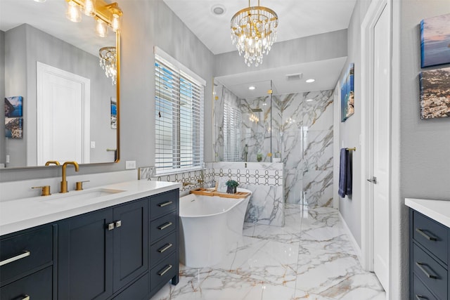 full bathroom with marble finish floor, a marble finish shower, visible vents, vanity, and a chandelier