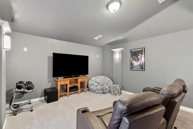 carpeted living room featuring vaulted ceiling, a textured ceiling, visible vents, and baseboards