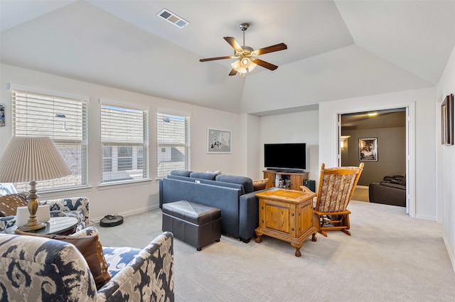 living room featuring a ceiling fan, visible vents, vaulted ceiling, baseboards, and light carpet