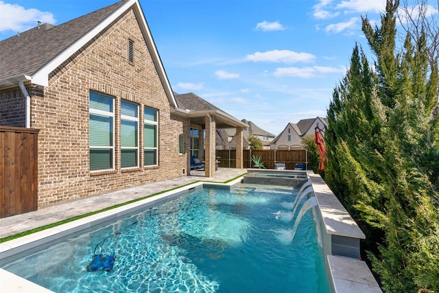 view of pool featuring a patio area, fence, and a fenced in pool