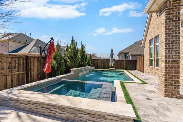 view of swimming pool featuring a fenced backyard, a fenced in pool, and a patio