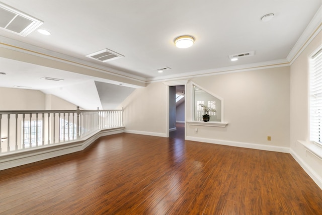 unfurnished room featuring crown molding, visible vents, and wood finished floors