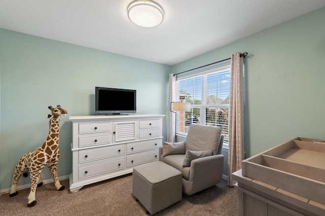 bedroom with baseboards and dark carpet