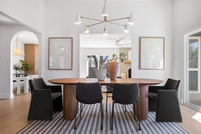 dining room with a ceiling fan and wood finished floors