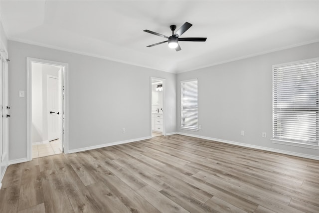 unfurnished room with a healthy amount of sunlight, ceiling fan, and wood finished floors