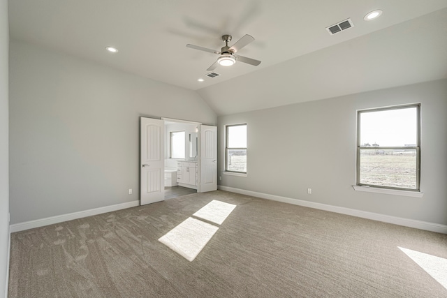 unfurnished bedroom featuring visible vents, baseboards, lofted ceiling, carpet, and recessed lighting