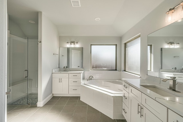 bathroom with a stall shower, a sink, visible vents, and tile patterned floors