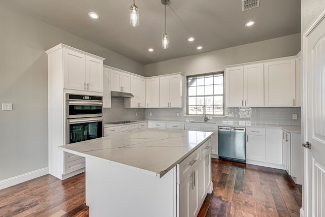 kitchen with stainless steel appliances, tasteful backsplash, visible vents, and under cabinet range hood