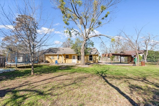 806 N College Ave, West, TX 76691 - view of yard featuring a trampoline and a patio