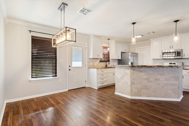 806 N College Ave, West, TX 76691 - kitchen featuring appliances with stainless steel finishes, white cabinets, visible vents, and dark wood finished floors
