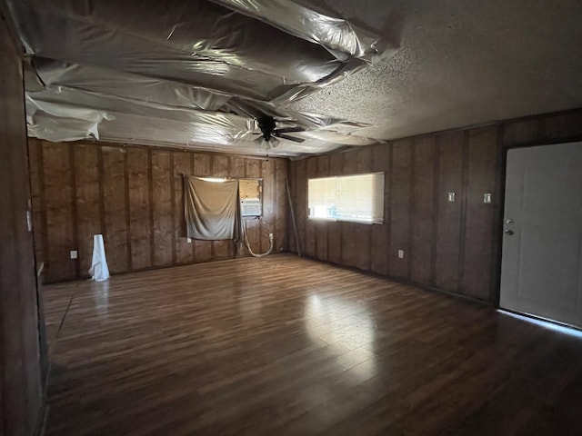 unfurnished room with wood finished floors