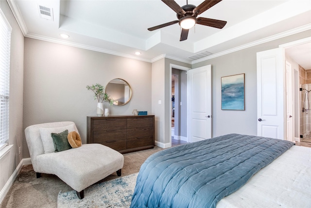 bedroom featuring a raised ceiling, visible vents, and baseboards