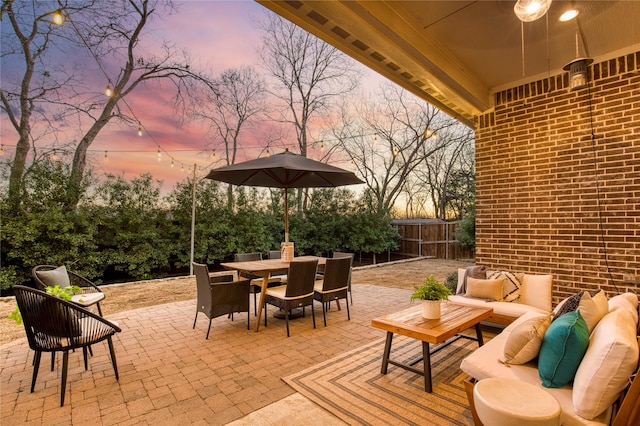 view of patio / terrace featuring outdoor dining space, outdoor lounge area, and a fenced backyard