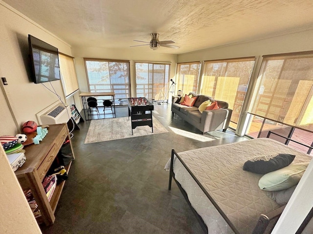 sunroom / solarium with ceiling fan and plenty of natural light