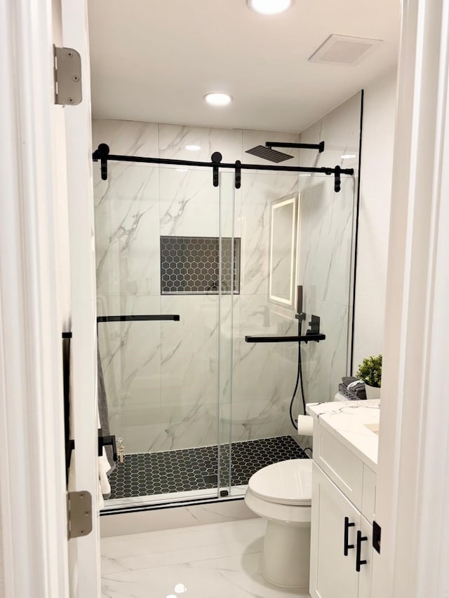 full bathroom featuring toilet, visible vents, vanity, marble finish floor, and a marble finish shower