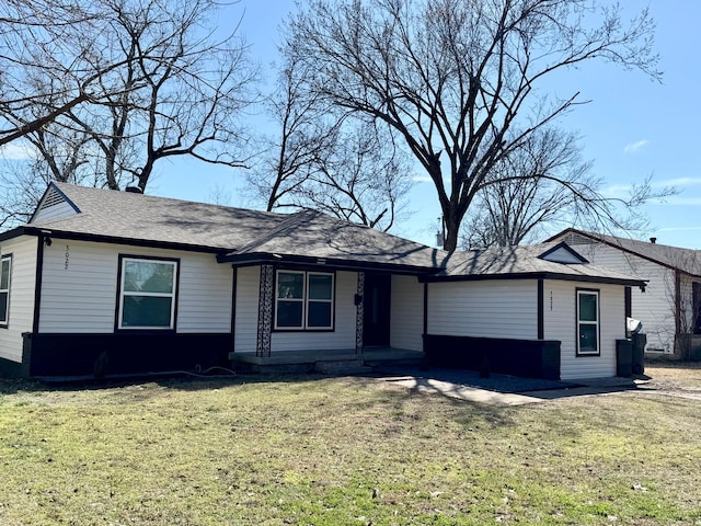 ranch-style home with a front lawn