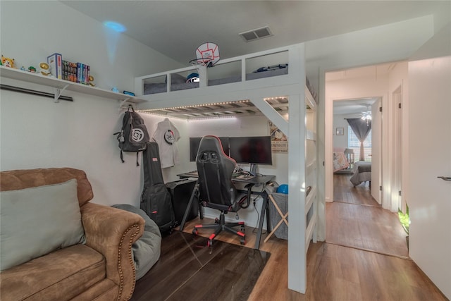 interior space featuring visible vents and wood finished floors