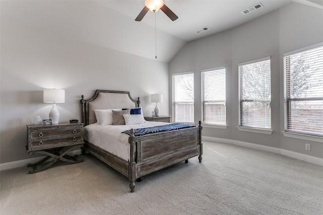 carpeted bedroom featuring vaulted ceiling, visible vents, and baseboards