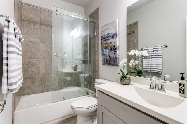 bathroom featuring shower / bath combination with glass door, vanity, and toilet