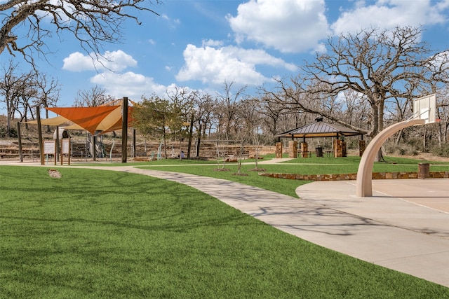 view of property's community with a yard and a gazebo