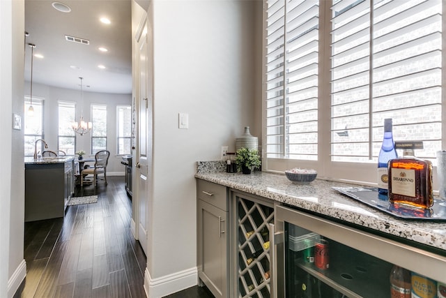 bar with wine cooler, visible vents, dark wood-type flooring, and recessed lighting