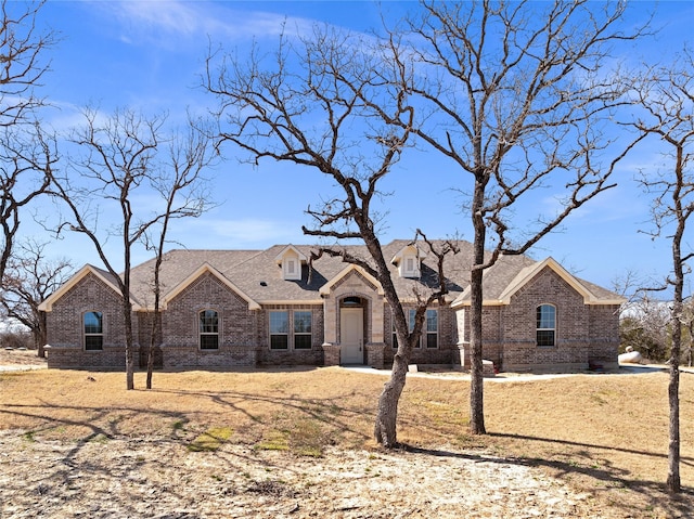 414 County Road 4598, Boyd, TX 76023 - french country style house with roof with shingles and brick siding