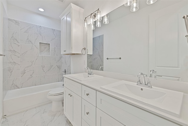 full bathroom featuring marble finish floor, a sink, toilet, and double vanity