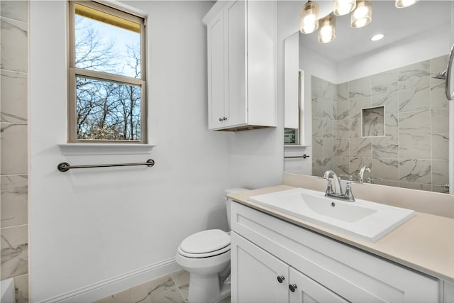 full bath featuring toilet, vanity, baseboards, marble finish floor, and a shower